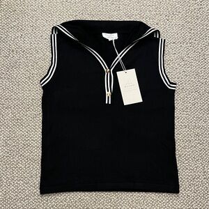 Black Sleeveless Knit Top with White Stripes